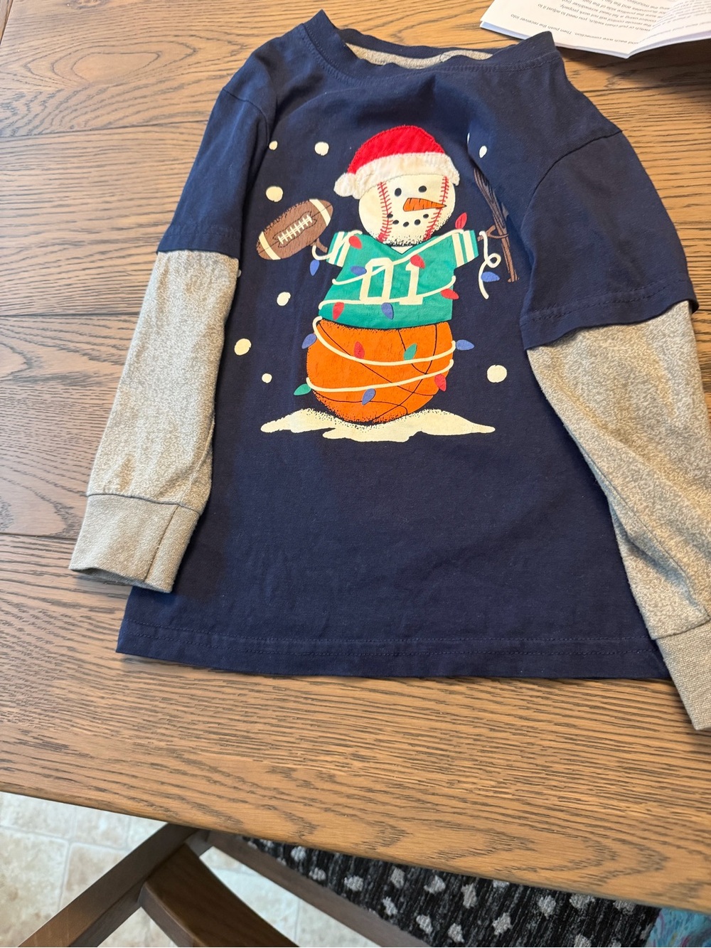 This children's long-sleeve layered tee is produced by CR Sports
